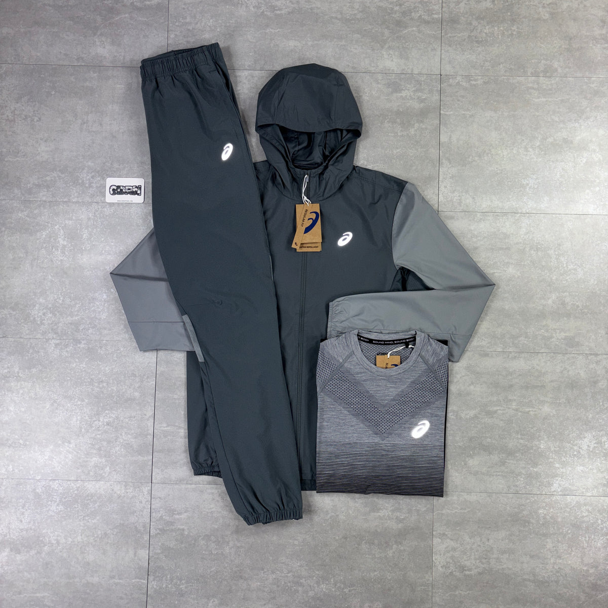 Asics Core Windbreaker Jacket Grey, Black/Grey Asics Seamless T-Shirt & Grey Asics Core Woven Pants Set