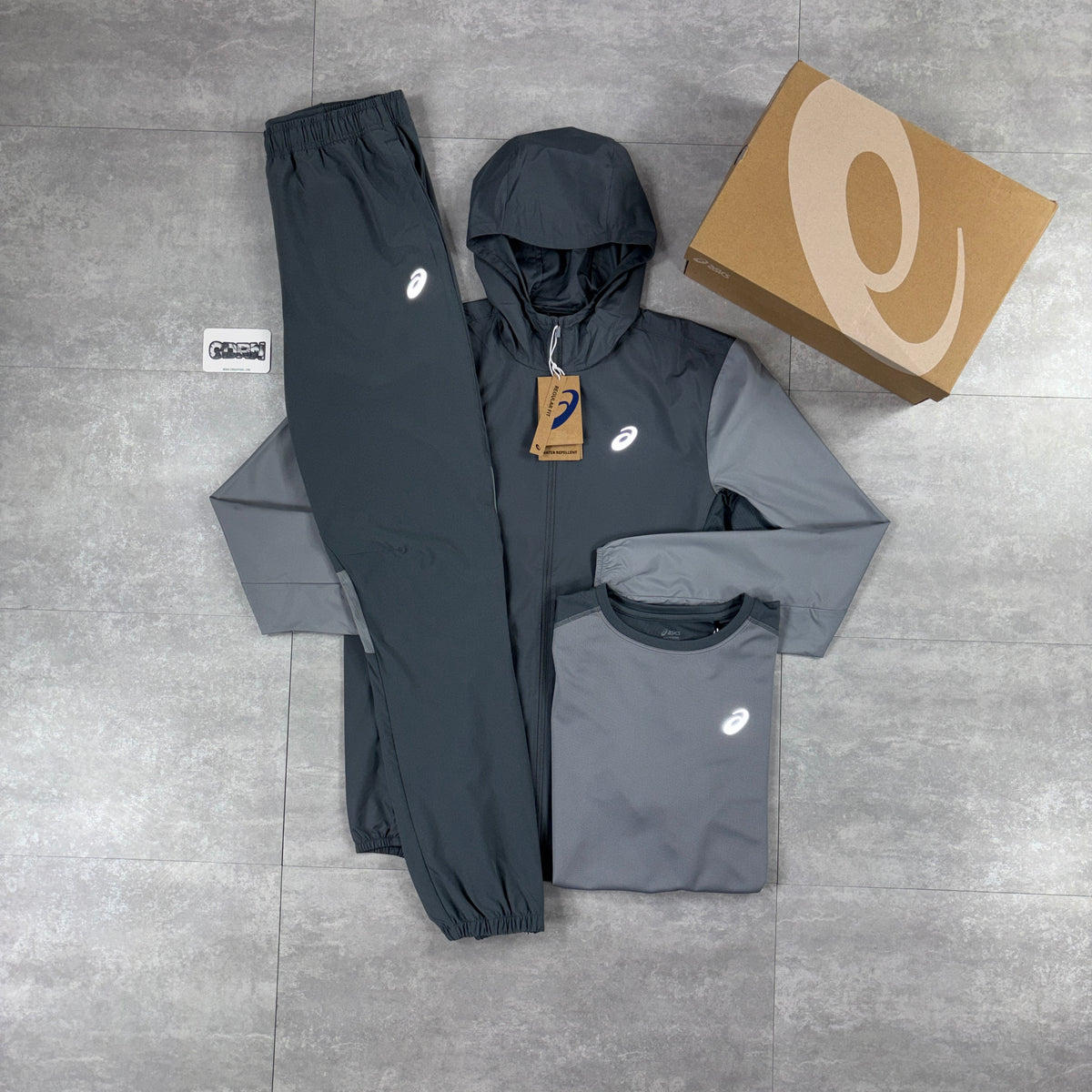 Asics Core Windbreaker Jacket Grey, Grey Asics Core T-Shirt & Grey Asics Core Woven Pants Set