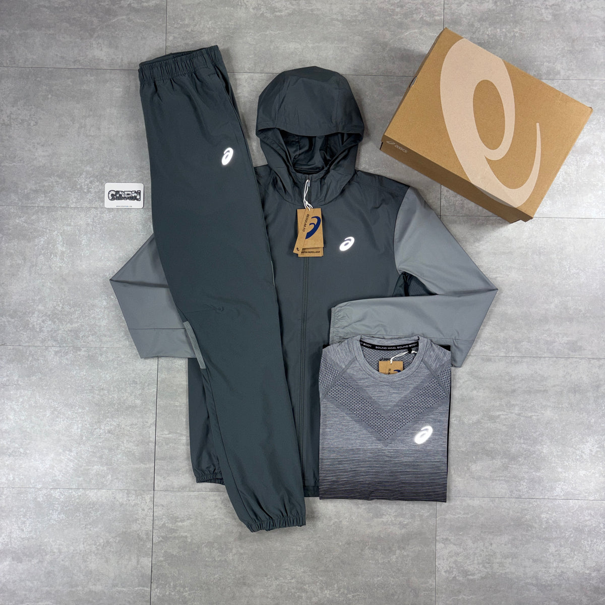 Asics Core Windbreaker Jacket Grey, Black/Grey Asics Seamless T-Shirt & Grey Asics Core Woven Pants Set