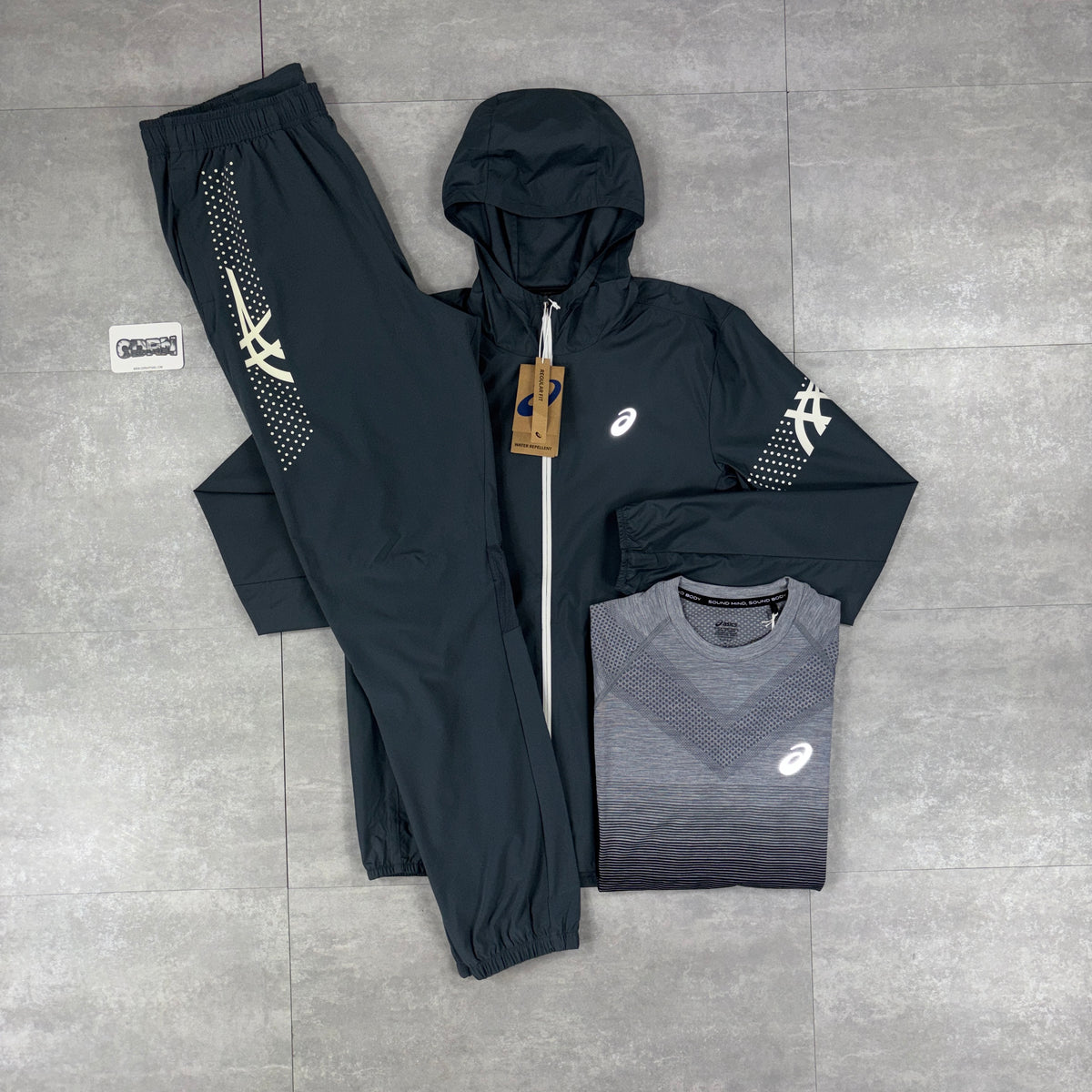 Asics Icon Windbreaker Jacket Carrier Grey, Black / Grey Seamless T-Shirt & Carrier Grey Asics Icon Pants Bundle